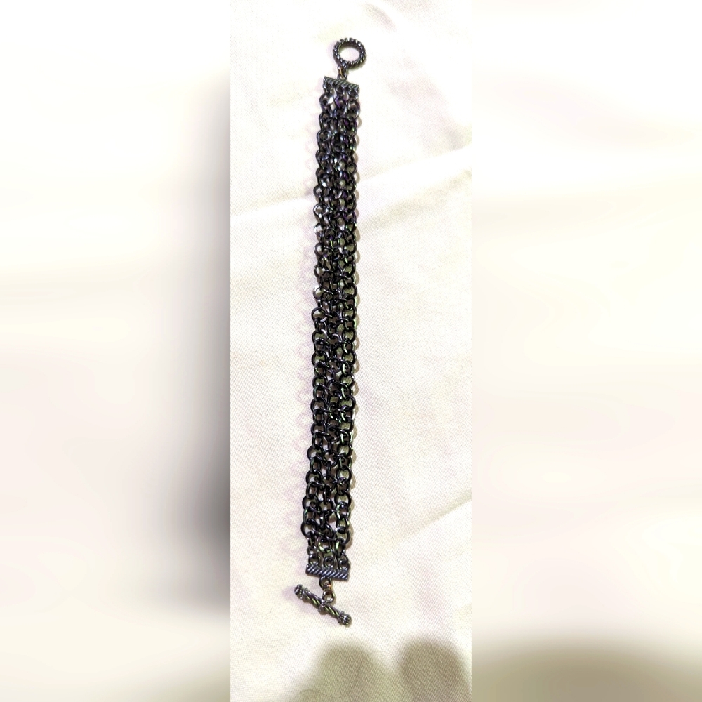 Ladies bracelet. Black 3 stranded. Looks iridescent